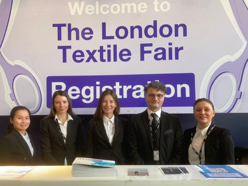 A team of registration staff at a London exhibition checking in thousands of guests