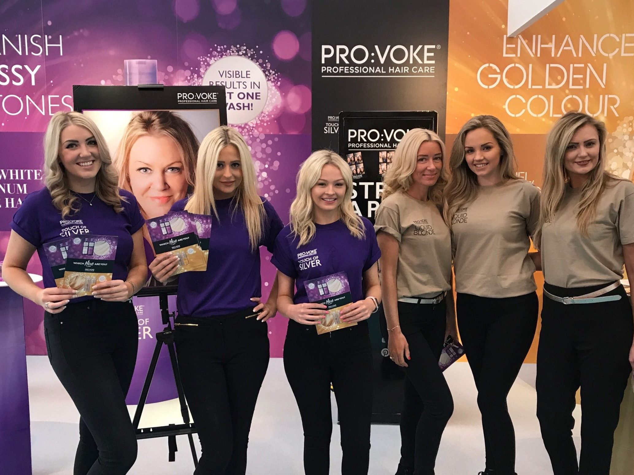 Promotional models at an exhibition with product samples