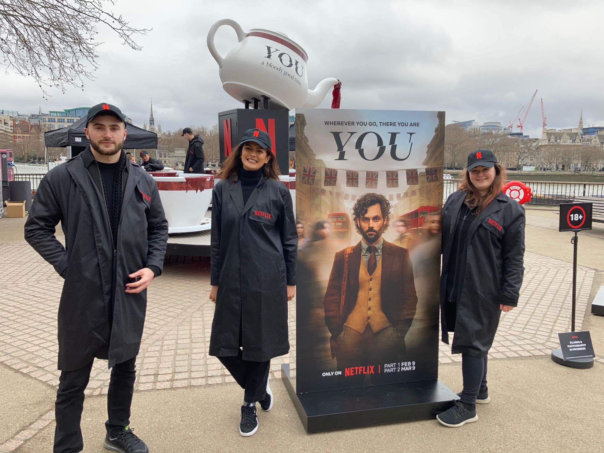 TV show promo staff at an interactive event with a tea-cup ride
