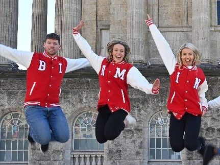 Promotional models jumping at a photoshoot