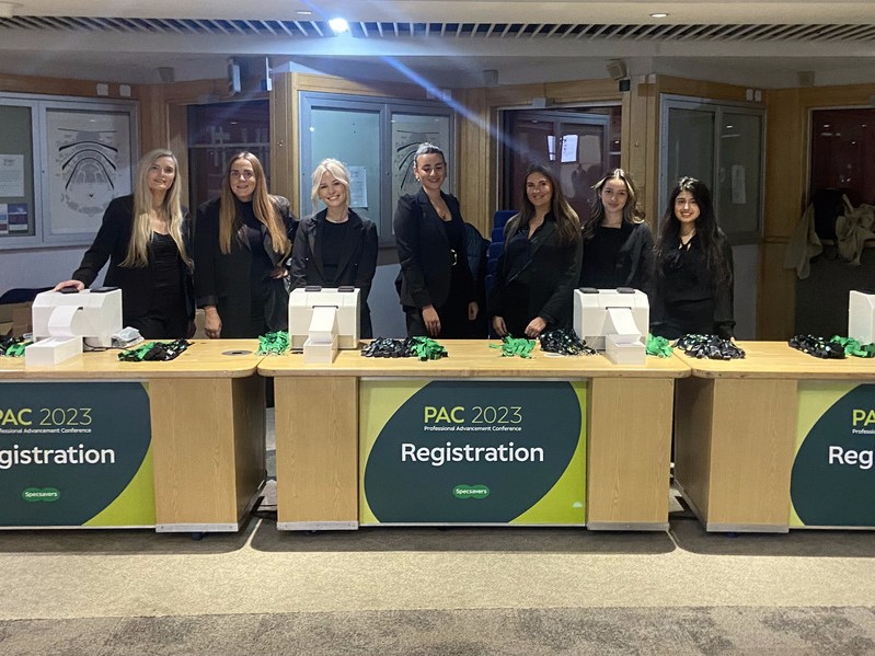 Registration Staff checking in delegates and sorting IDs